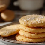 A close-up of freshly baked Tahini Butter Cookies on a tray